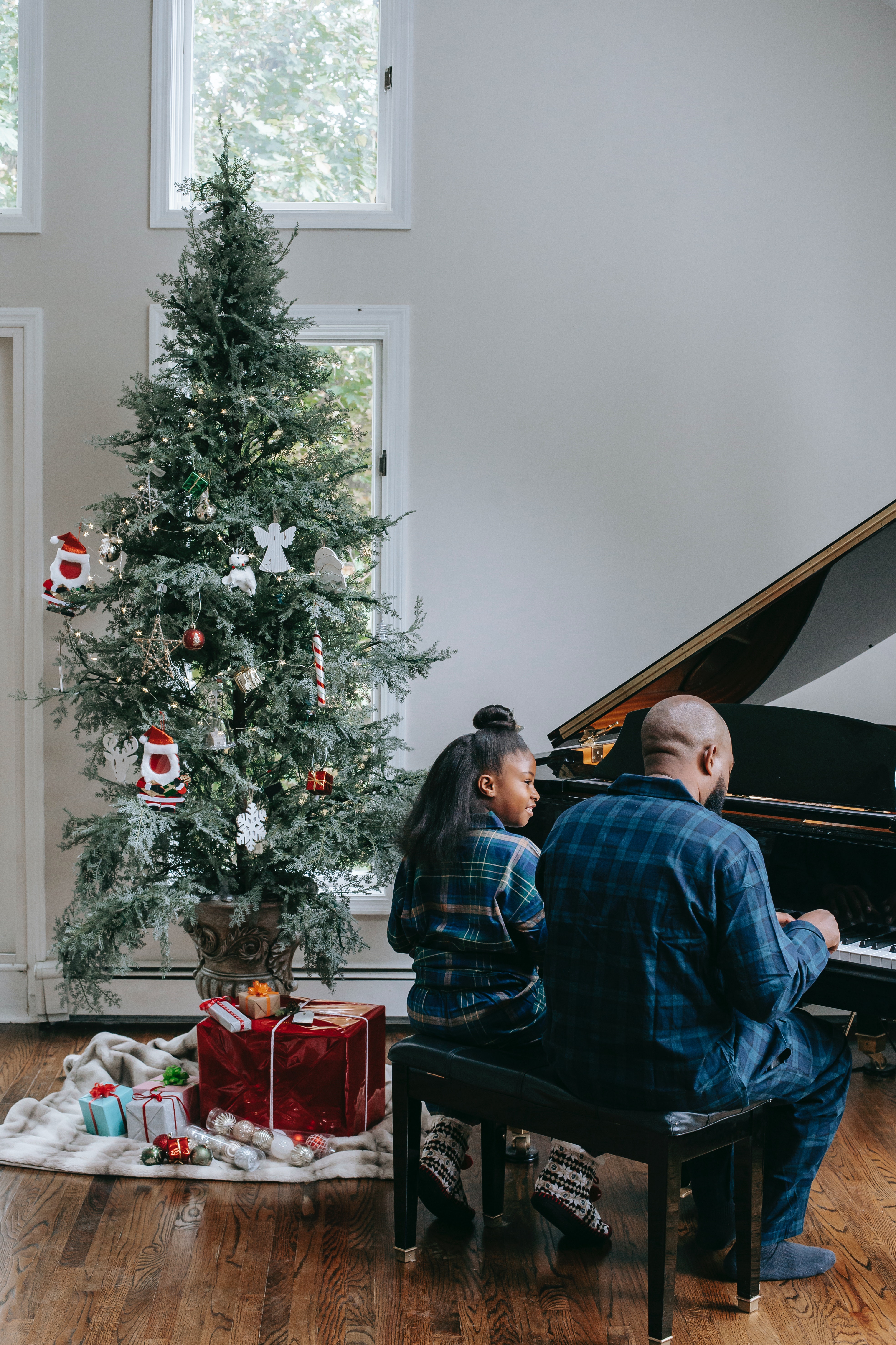 Photo by Any Lane: https://www.pexels.com/photo/a-father-and-her-child-playing-a-piano-near-a-christmas-tree-5728300/